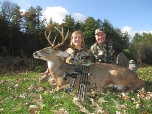 bow hunters with whitetail deer