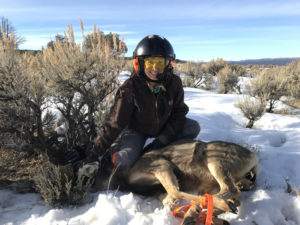 woman tagging a deer