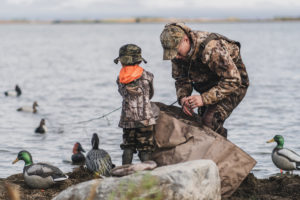 man and child getting ready to fish