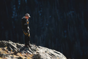 Patrick standing on top of a cliff