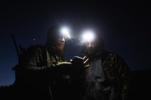 hunters with headlamps