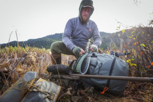 man hunting packing up his gear
