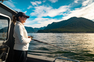 woman fishing on lake